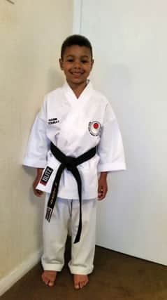 Habib Touray, six, loves going to his karate clases at West Community Centre.