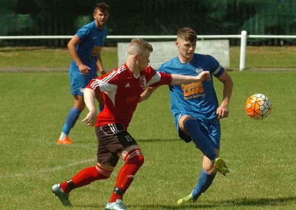 Northern League side Sunderland RCA's James Cassidy (red) battles against Pickering in last week's Meadow Park friendly
