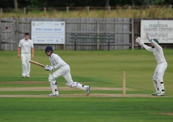 Durham Academy batsman Chris McBride hits a single against Hetton Lyons. Picture by Tim Richardson