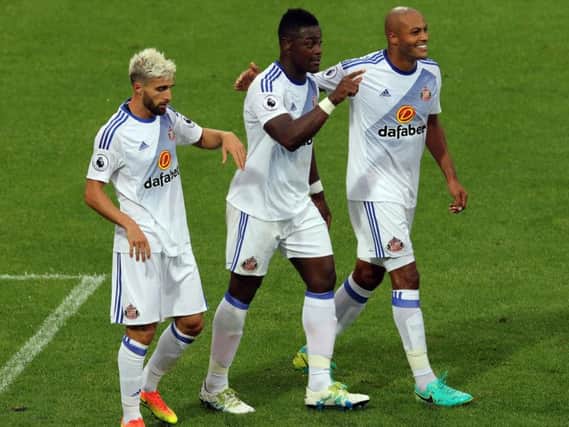Lamine Kone celebrates his goal for Sunderland against Borussia Dortmund alongside Fabio Borini and Younes Kaboul.