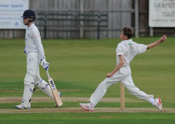 Reece Wood bowls for Hetton Lyons in last week's clash with Durham Academy