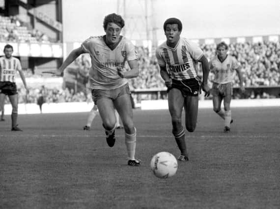 Howard Gayle, right, during his Sunderland days, in a race for the ball with Steve Bruce of Norwich City, who would manage the Black Cats many years later.