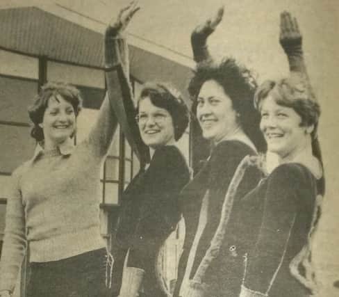 Janet Oliver, Glynis Summerson and Cherine Turner are shown how to pose by Rowena Thompson.