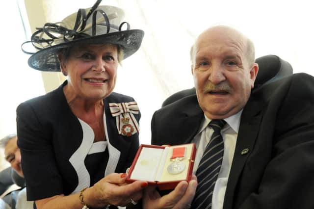 Billy Hill receives his British Empire Medal from the Lord Lieutenant of Durham, Sue Snowdon.