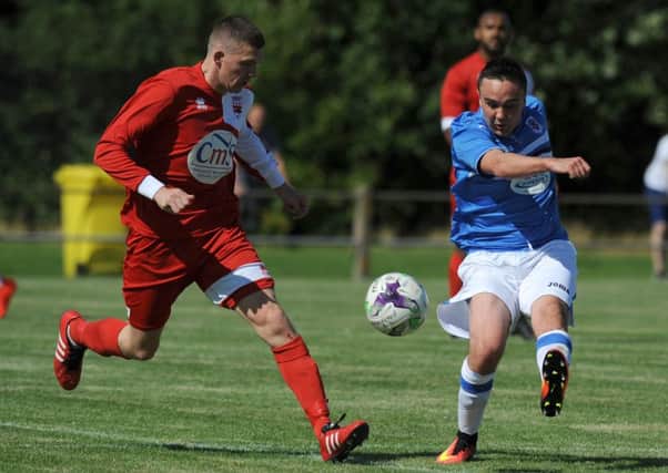 Seaham Red Star (right) take on Washington's Joe Walton in Saturday's Division One clash. Picture by Tim Richardson