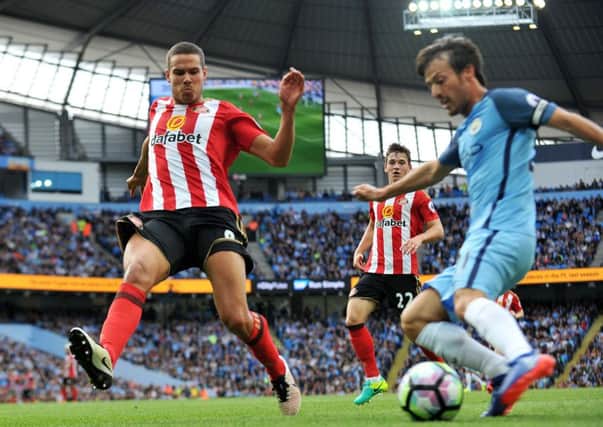 Sunderland midfielder Jack Rodwell closes down Manchester City's David Silva. Picture by Frank Reid