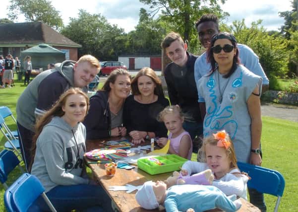 Members of the National Citizens Service helping with children's crafts at the Grace House Fun Day at Wearmouth CW, Thompson Road, Sunderland.