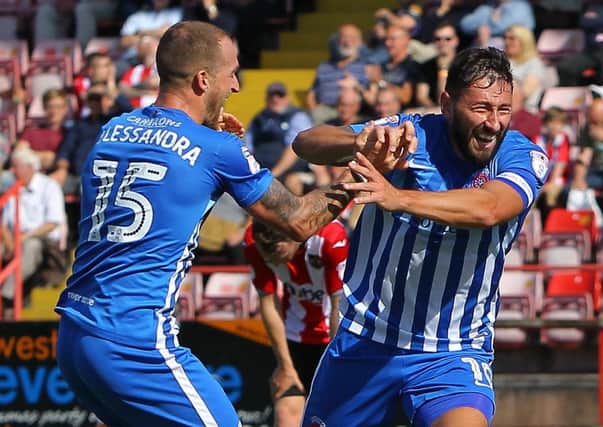Billy Paynter (right) celebrates his winner for Hartlepool United at Exeter