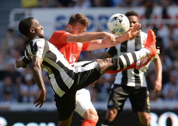 Newcastle midfielder Vurnon Anita battles against Jonathan Hogg in Saturday's 2-1 defeat at St James's Park