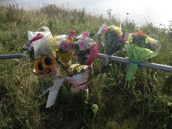 Flowers left on the cliff tops at Marsden, South Shields, for 17-year-old Chirelle Calder.