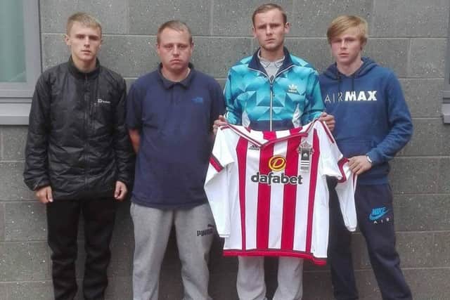 Julie Snowball's sons (from left) Aaron, Dean, Callum and Kyle, with the a shirt from her beloved Sunderland AFC.
