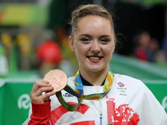 Amy Tinkler celebrates a bronze medal in the Women's Floor Exercise final at the Rio Olympic Arena. Pic: PA.
