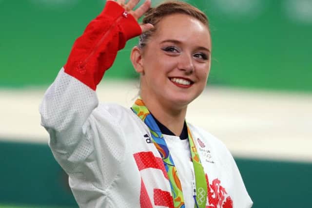 Amy Tinkler celebrates her bronze medal in the Women's Floor Exercise final. Pic: PA.