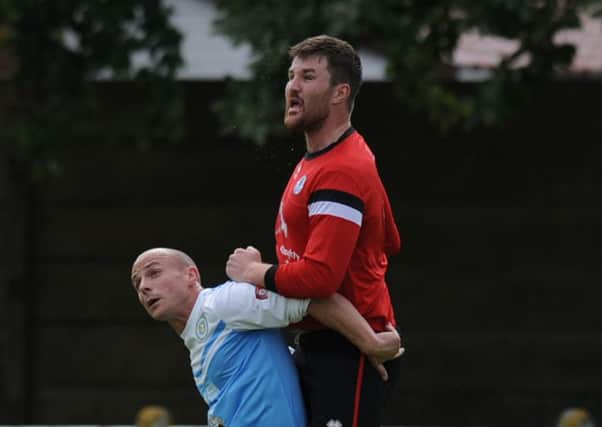 Departing Silksworth CW defender Phil Hall climbs highest against Harton and Westoe. Picture by Tim Richardson
