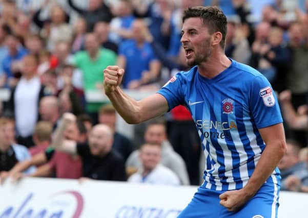 Padraig Amond celebrates scoring for Pools against Newport. Picture by Tom Banks