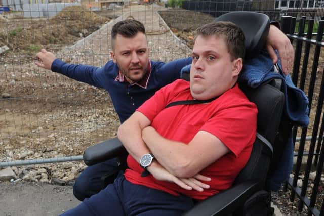 Wheelchair user Shaun Barker, with cousin Chris Eggleston, whose five minute journey around Doxford Park took him over an hour and a half.