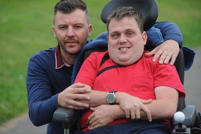 Wheelchair user Shaun Barker, with cousin Chris Eggleston, whose five minute journey around Doxford Park took him over an hour and a half.