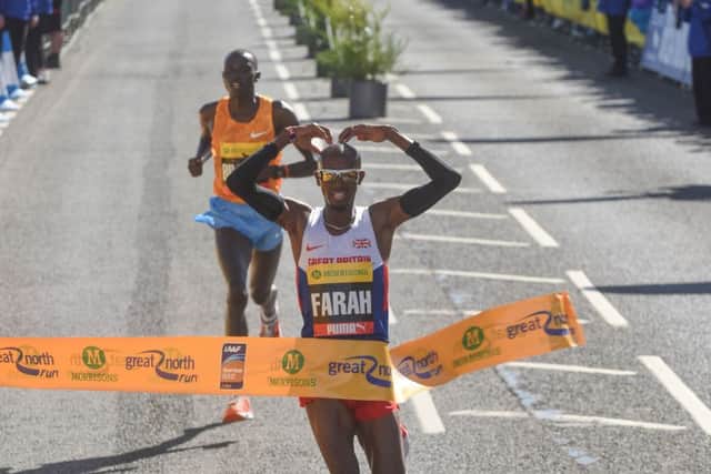 Mo Farah crosses the finish line to win the Great North Run in 2015.