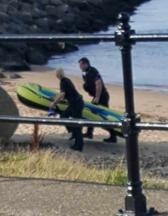 A dinghy was later removed from the scene. Photo by Steve Keeley.
