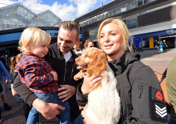 New police puppies launch to find names.
Dog handlers Sgt Julie Neve with Sean Defty and son Oscar Defty aged 16 months