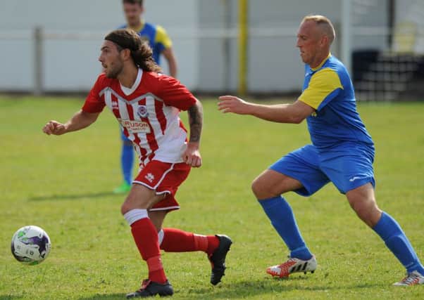 Seaham Red Star's Luke Proctor (left) makes a move against Jarrow Roofing in last weekend's Northern League Division One clash