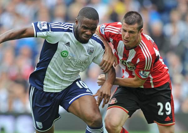 Victor Anichebe in action for West Brom against Sunderland's Valentin Roberge back in August 2014
