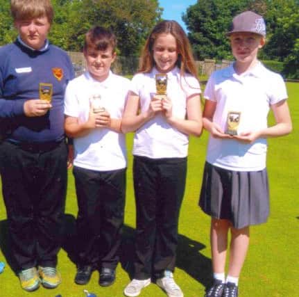 Some of the pupils who won trophies in the competition.