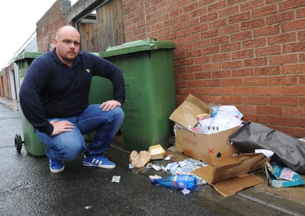 Kevin Day says he has seen rats around the rubbish left in the back lane.