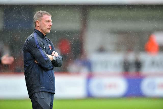 Craig Hignett suffers in the rain, watching his Hartlepool United side slump to defeat at Stevenage. Picture by Frank Reid