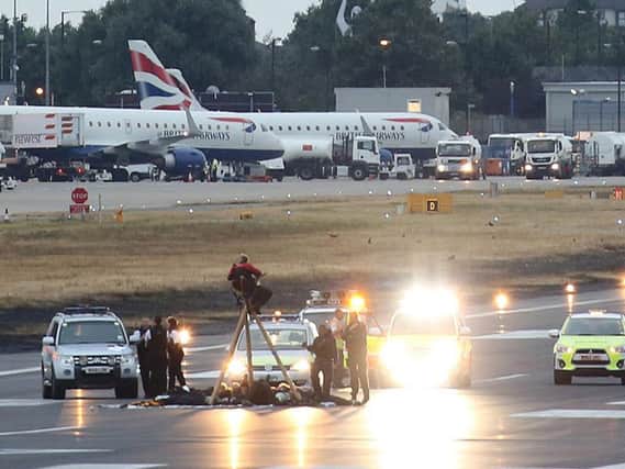 Protesters stormed the runway at London City Airport earlier today. Picture: Jonathan Goldberg/Black Lives Matter UK /PA Wire.