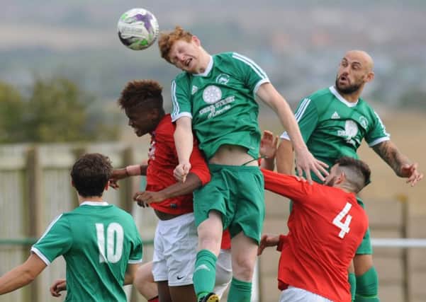 Easington Colliery (green) attack the Thackley goal on Saturday. Picture by Tim Richardson