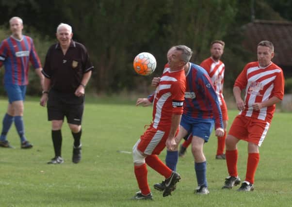Oddfellows Arms Over-40s (red) take on Ivy Legends in the Over-40s League last weekend