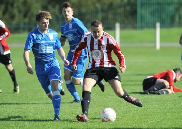 Wearside  League action between Sunderland West End (red and white) and  Seaham Red Star Reserves