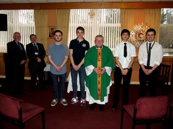 Pupils from St Aidan's School receiving their bursary cheques, from left to right, are Bro. Tony McCourt, Sunderland Circle Schools Liaison Officer, Mr. Gerry Nelson, the visit coordinator, Matthew Morrell, Thomas Buckley, Fr. Martin Wheaton of St. Marys Church, Sunderland, Aidan Fletcher and, Aidan Watson, school chaplain.
