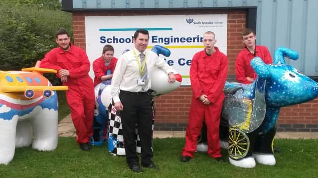 Centre, Dave Cleary, Head of Learning and Standards for Engineering and Advanced Manufacturing at South Tyneside College, with, l-r, students Leon Stickley, Jack Smith, Joe Hubbick and Darryl Seago.
