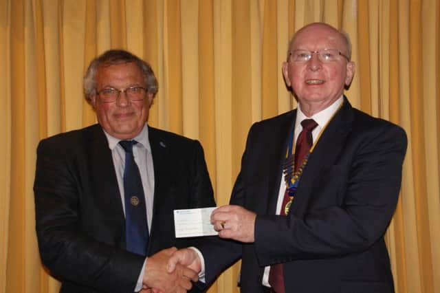 Ashley Burland,Club, Hougjton Rotary club  President, right, hands over a cheque to Steve Cox for Myaware fighting Ocular Myasthenia Gravis, an incurable auto-immune disease.