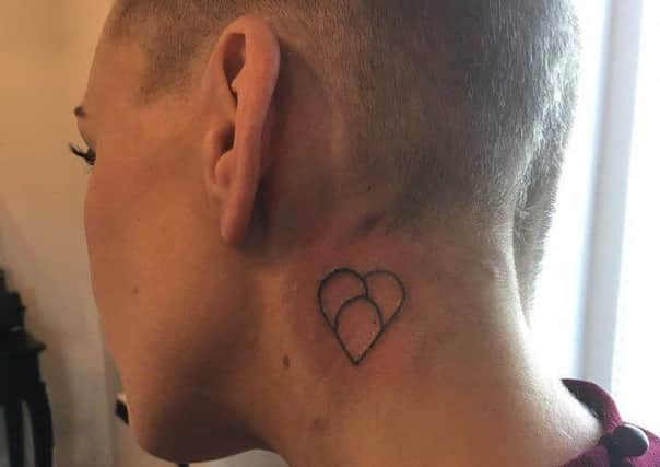 Dedicated fundraiser Jill Bridges shaved her head and got a tattoo for Bradley.