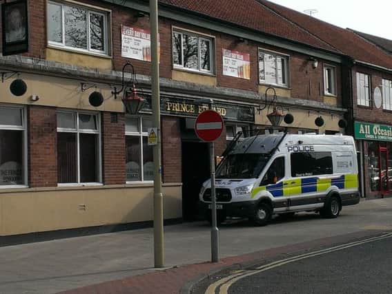 Police outside The Prince Edward pub after the disturbance in which Ronnie Howard died.