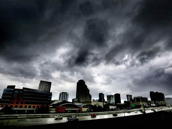 The first outer bands of rain from Hurricane Matthew pass over downtown Orlando. Picture: Joe Burbank/Orlando Sentinel.