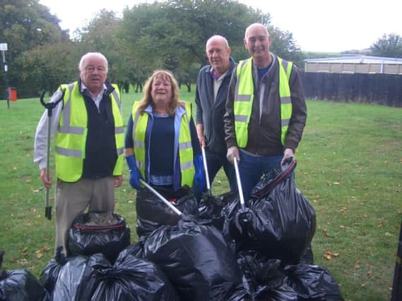 Volunteers with the sack loads of rubbish they collected from Middle Herrington Park.