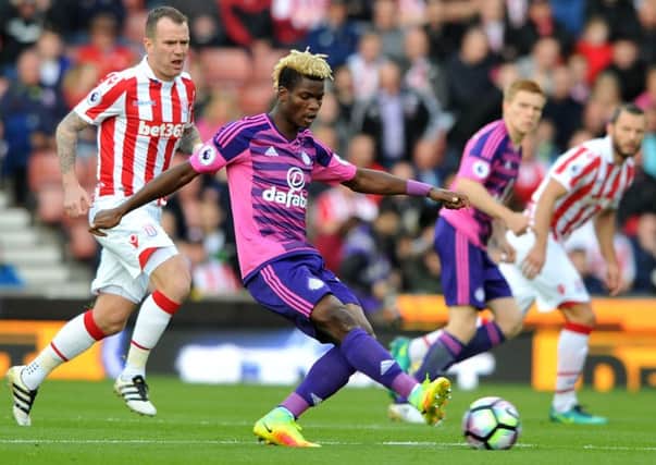Didier Ndong gets away from Stoke's Glenn Whelan to play a pass out of midfield. Picture by Frank Reid