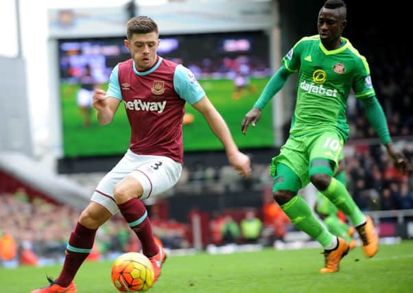 West Ham left-back Aaron Cresswell (left) defends against Dame Ndoye in Sunderland's last visit to the capital to take on the Hammers. Cresswell is suspended for tomorrow's rematch. Picture by Frank Reid
