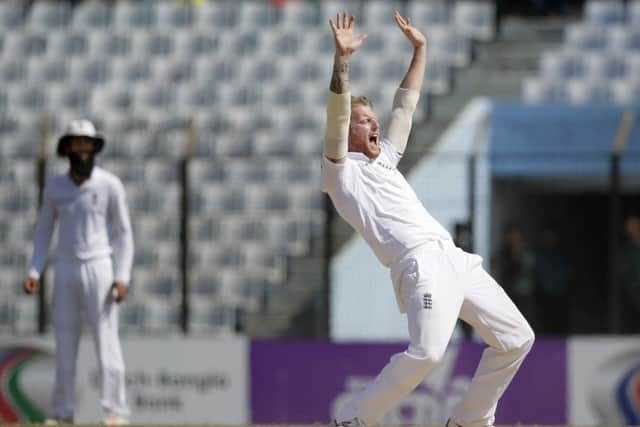 England's Ben Stokes, right, successfully makes an appeal to dismiss of Bangladesh's Taijul Islam