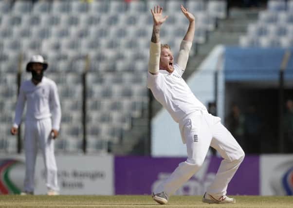 England's Ben Stokes, right, successfully makes an appeal to dismiss of Bangladesh's Taijul Islam