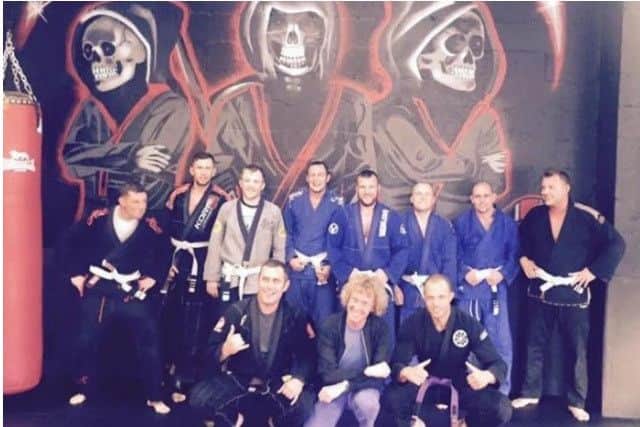 Grayson Perry with fighters from Made for the Cage.