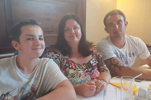 Tracey Sawyer-Copus with her sons Alex and Aaron.