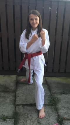Kayna Turner, 12, who trains at Red House Workingmans Club, double graded at a recent NKA grading session.