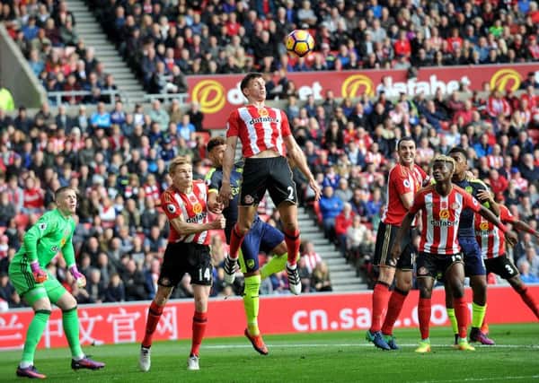 Billy Jones rises highest to head clear as Sunderland come under pressure from Arsenal. Picture by Frank Reid