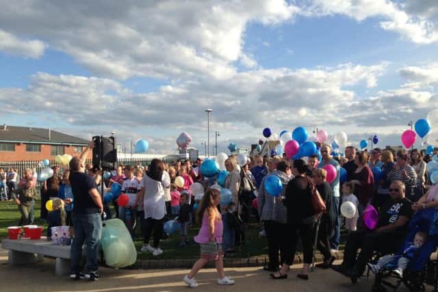 A vigil and balloon release held in tribute to Megan Bell.