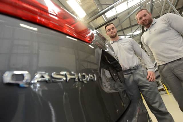 Nissan workers Conner Pollard and Mark Holder (R) after Qashqai and X-Trail announcement